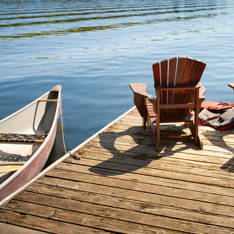 chair on a dock along a river